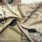 Preview: Dekostoff aus Baumwollgemisch in braun mit Patches aus verschiedenen Vintagemotiven