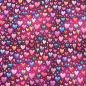 Preview: Kuschelweicher und warmer Sweatstoff in beere mit bunten Herzen gemustert
