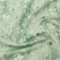 Preview: Weicher angenehmer French Terry in mint mit Eukalyptuszweigen gemustert