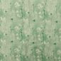 Preview: Weicher angenehmer French Terry in mint mit Eukalyptuszweigen gemustert