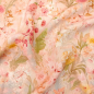 Preview: Weiche luftige Viskose in Peach-Farbtönen mit sommerlichen Blumen gemustert