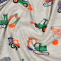 Preview: Kuschelweicher Jersey in ecru melange mit Baufahrzeugen gemustert