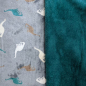 Preview: Kuscheliger Wellnessfleece in dusty blue mit Dinosaurier gemustert