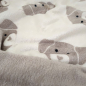 Preview: Kuscheliger Wellnessfleece in sand mit süßen Hunden gemustert