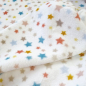 Preview: Kuscheliger Wellnessfleece mit bunten Sternchen