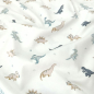 Preview: Kuschelweicher Jersey in ecru mit kleinen Babydinos gemustert