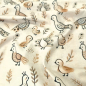 Preview: Kuschelweicher Jersey in sand melange mit kleinen Pfauen und Küken gemustert