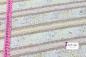 Preview: baumwoljersey in beige mit unterschiedlichen streifenmuster mit massband links