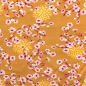 Preview: sehr weicher Baumwolljersey in senf mit Blümchen gemustert.