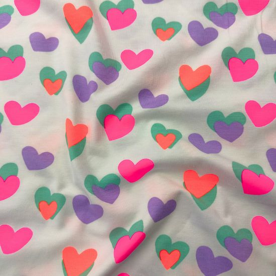 Kuschelweicher Jersey in weiss mit Neon Herzen gemustert
