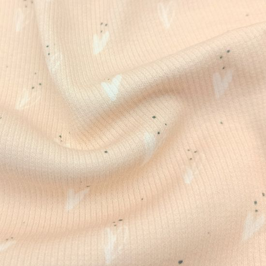 Weicher Ribjersey von Swafing in apricot mit kleinen Herzen gemustert