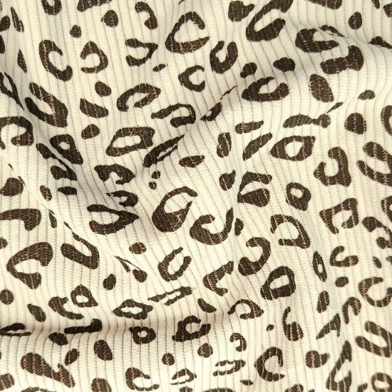 Weich fallender Baumwoll Stretch Cord in ecru mit Mini Leoprint gemustert