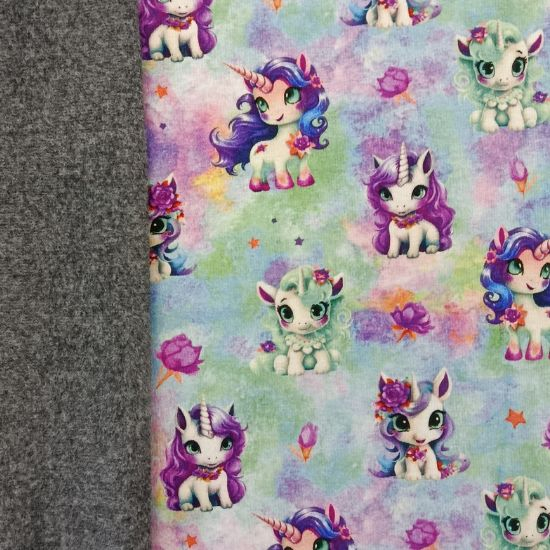 Preview: Superkuscheliger warmer Alpenfleece in bunten Farben mit Einhornbabys gemustert