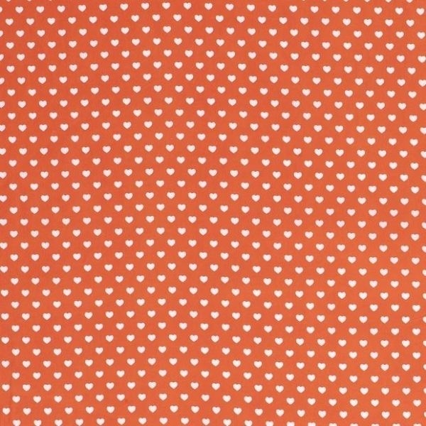 Baumwollstoff in orange mit verschiedenen Mustern.
