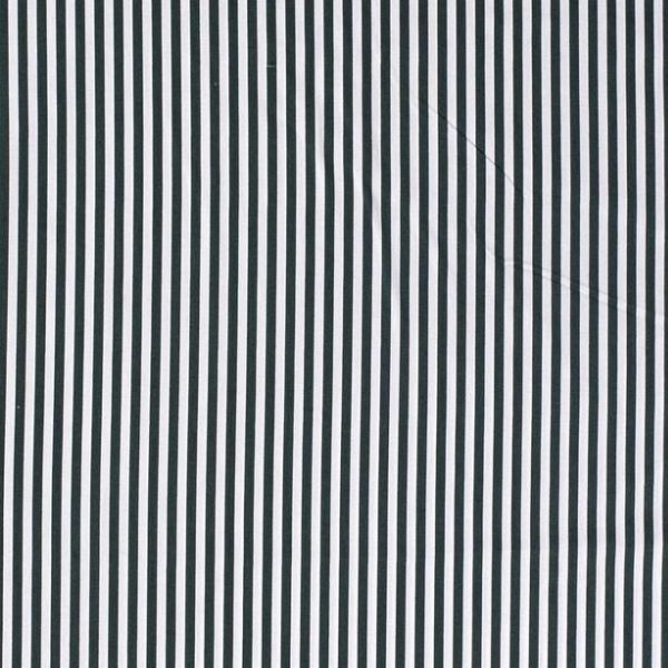 aumwollstoff in Tanne mit verschiedenen Mustern.