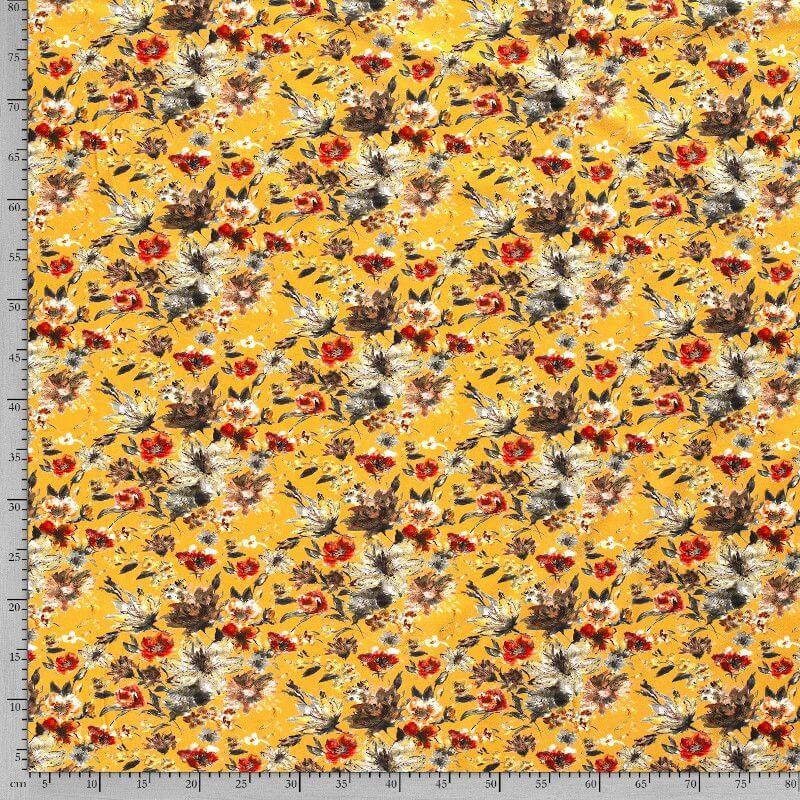 Baumwolljersey in senffarben gemustert mit großen Blumenblüten im Digitaldruck.