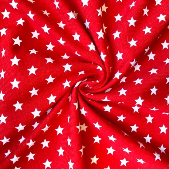 Baumwolljersey in rot mit Sternen gemustert.