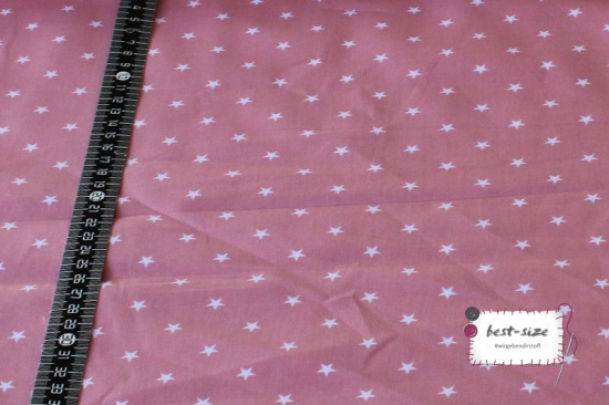 baumwollstoff in rosa gemustert mit kleinen weissen sternen