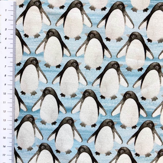 Preview: Weicher French Terry von Hilco gemustert mit kleinen Pinguinen in hellblau.