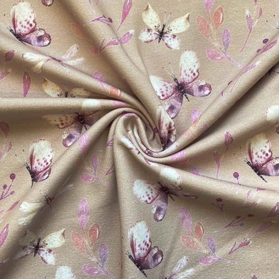 Preview: French Terry in beige mit schmetterlingen gemustert.