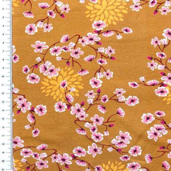 sehr weicher Baumwolljersey in senf mit Blümchen gemustert.