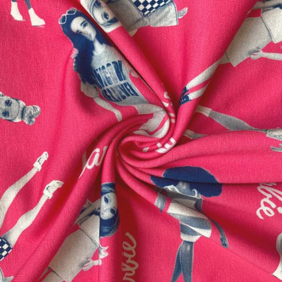 Preview: Baumwolljersey in pink mit Barbie gemustert
