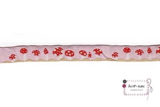 webband mit pilzen gemustert auf rosafarbenen hintergrund