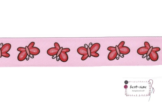 satainband mit pinken schmetterlingen gemustert auf rosa hintergrund