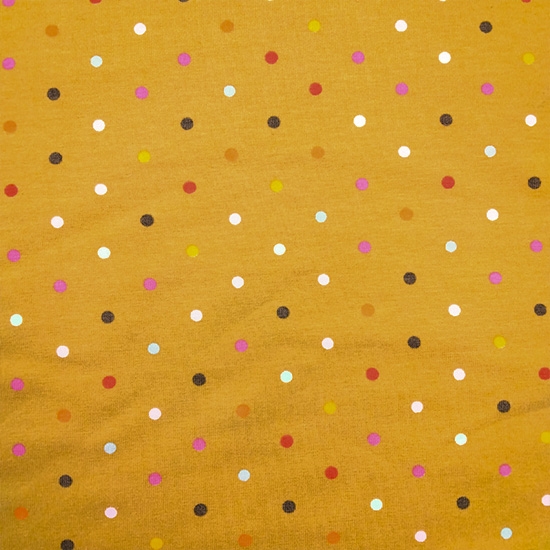 Baumwolljersey in Gelb mit bunten Punkten für farbenfrohe Kleidung, ideal aber auch für Baby- und Kinderkleidung