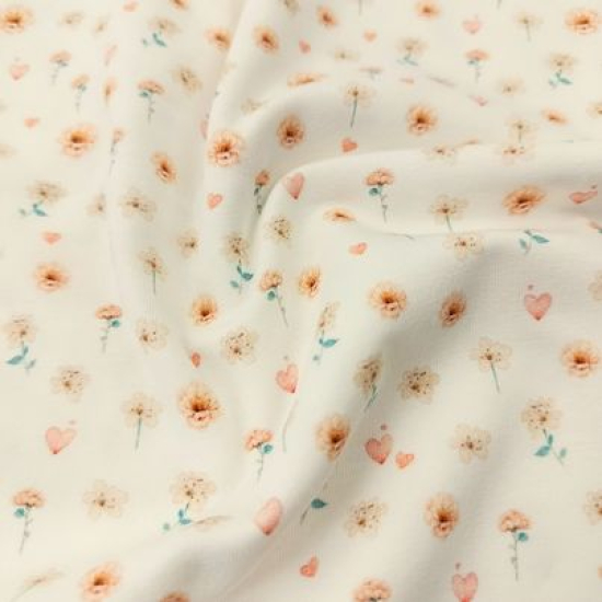 Kuschelweicher Jersey in ecru mit süßen Miniblüten und Herzchen gemustert