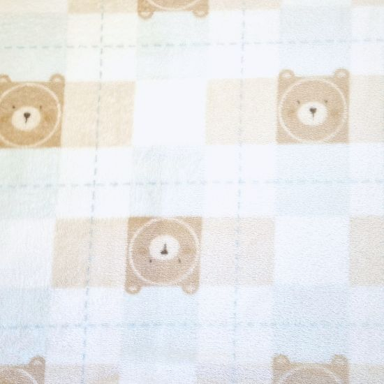 Kuscheliger Wellnessfleece mit Teddyköpfen und Karos gemustert