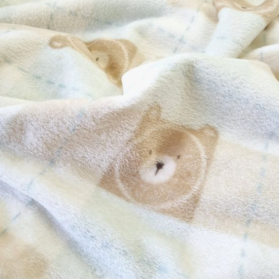 Kuscheliger Wellnessfleece mit Teddyköpfen und Karos gemustert