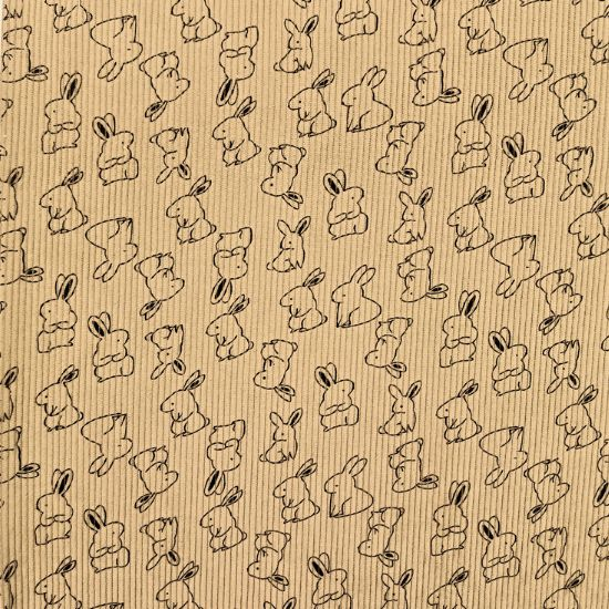 Weich fallender Baumwoll Stretch Cord in beige mit kleinen Hasen gemustert