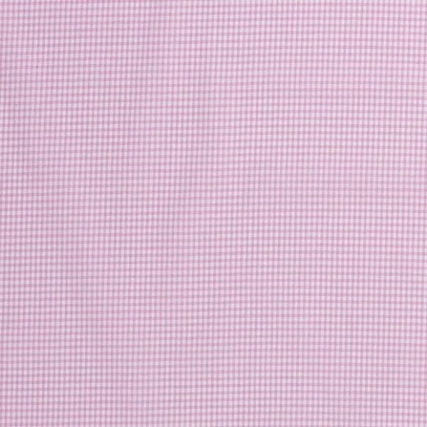 Baumwollstoff in rosa mit verschiedenen Mustern.