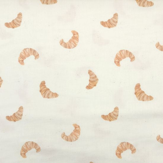 Weicher luftiger Musselin in ecru mit süßen Croissants gemustert