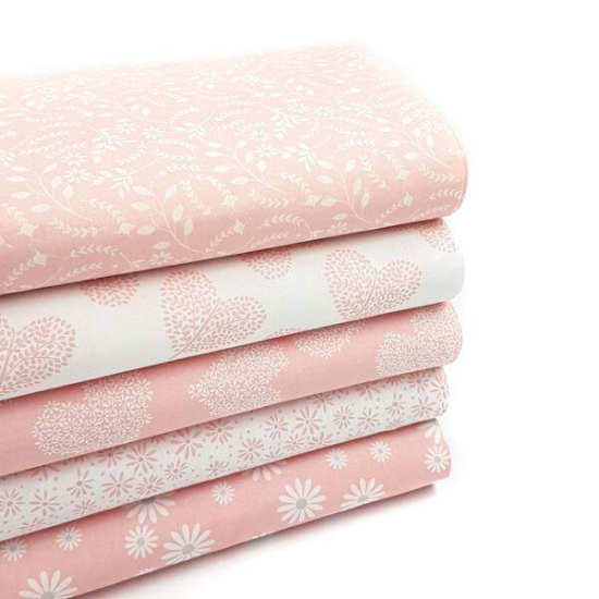 baumwoll popelin in rosa mit verschiedenen motiven