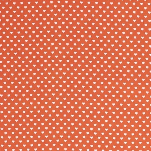 Baumwollstoff in orange mit verschiedenen Mustern.
