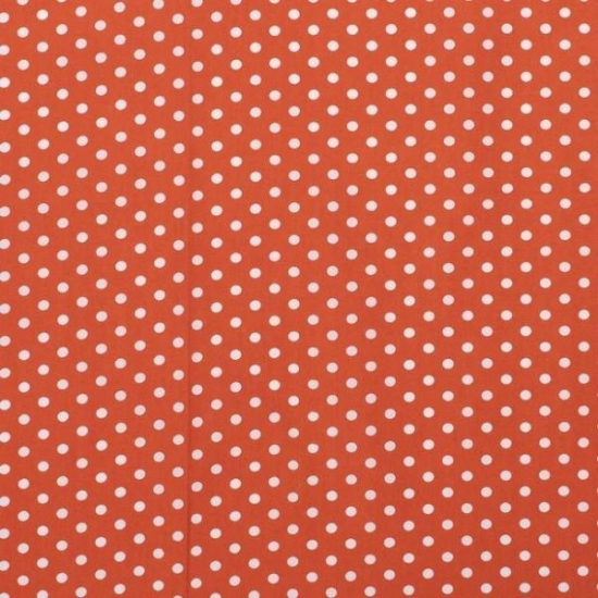 Baumwollstoff in orange mit verschiedenen Mustern.