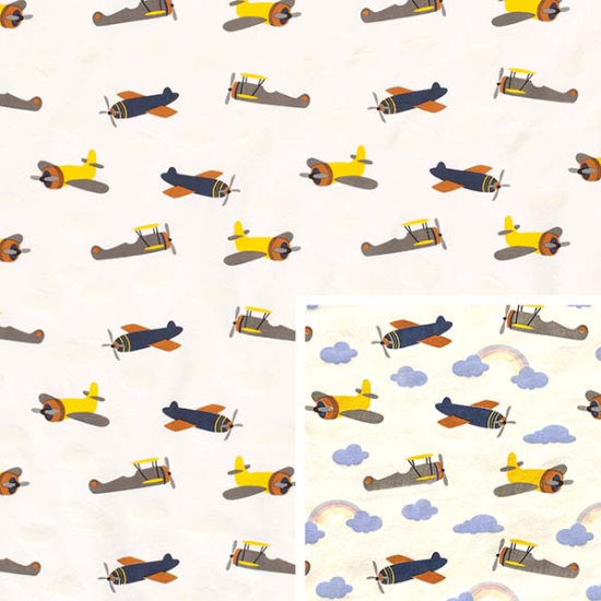 Baumwolljersey Zauberstoff in ecru mit kleinen Flugzeugen. Die Farbe und das Muster verändern sich im Sonnenlicht.