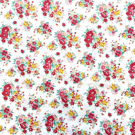 Baumwollstoff mit roten und Gelb Blumen gemustert.