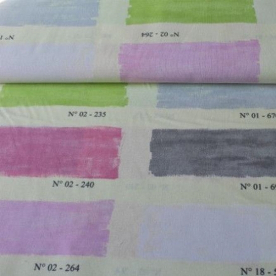 dekostoff in weiss gemustert mit farbboxen in verschiedenen farben