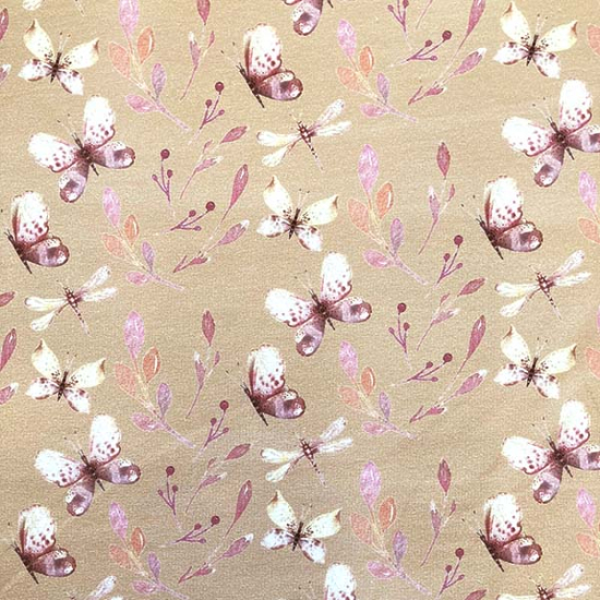 French Terry in beige mit schmetterlingen gemustert.