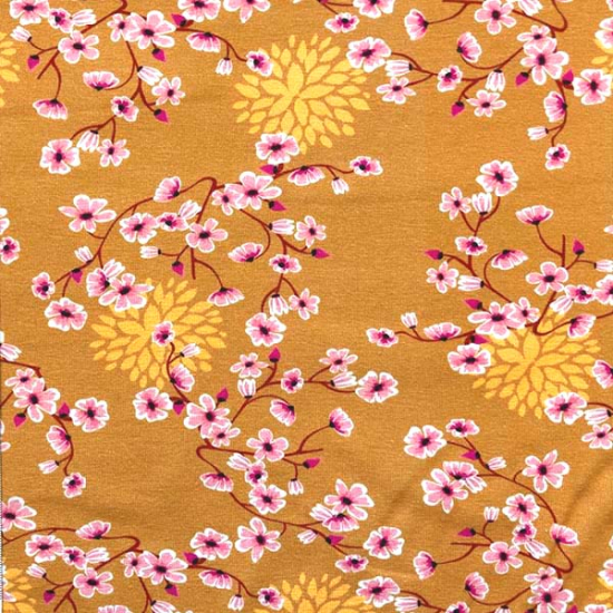 sehr weicher Baumwolljersey in senf mit Blümchen gemustert.